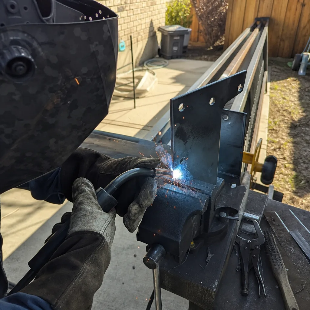 Professional welder performing gate parts repair and welding work nationwide